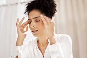 headache stress and black woman in home with pain       utc scaled